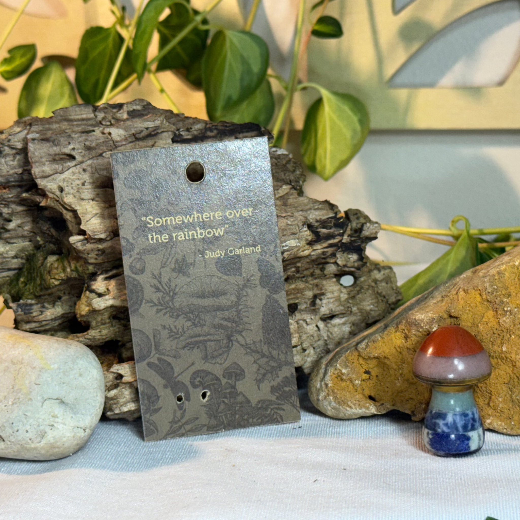 Card with mushroom design and a quote from Judy Garland on a natural background