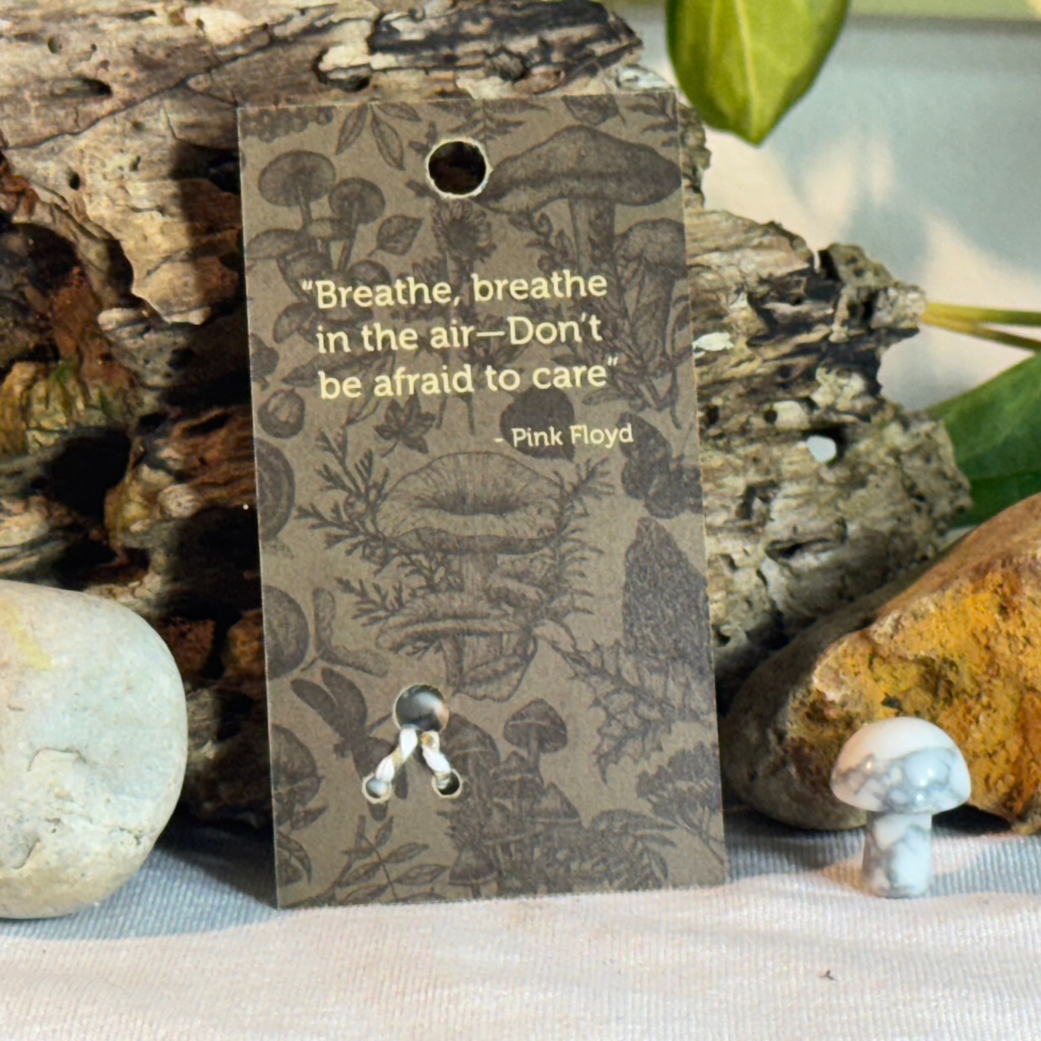 Card with mushroom design and a Pink Floyd quote on a natural background