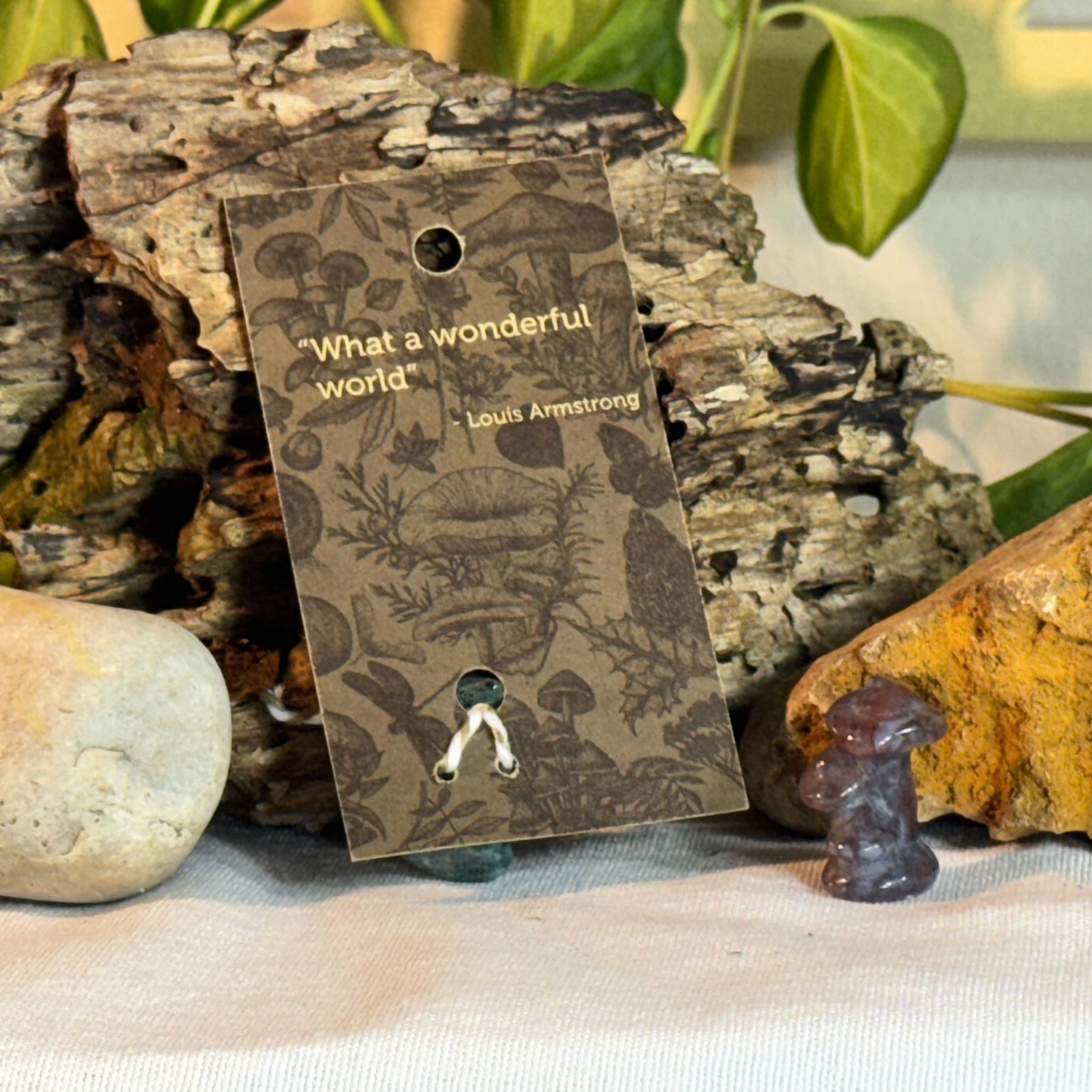 Card with mushroom design and a quote from Louis Armstrong on a natural background