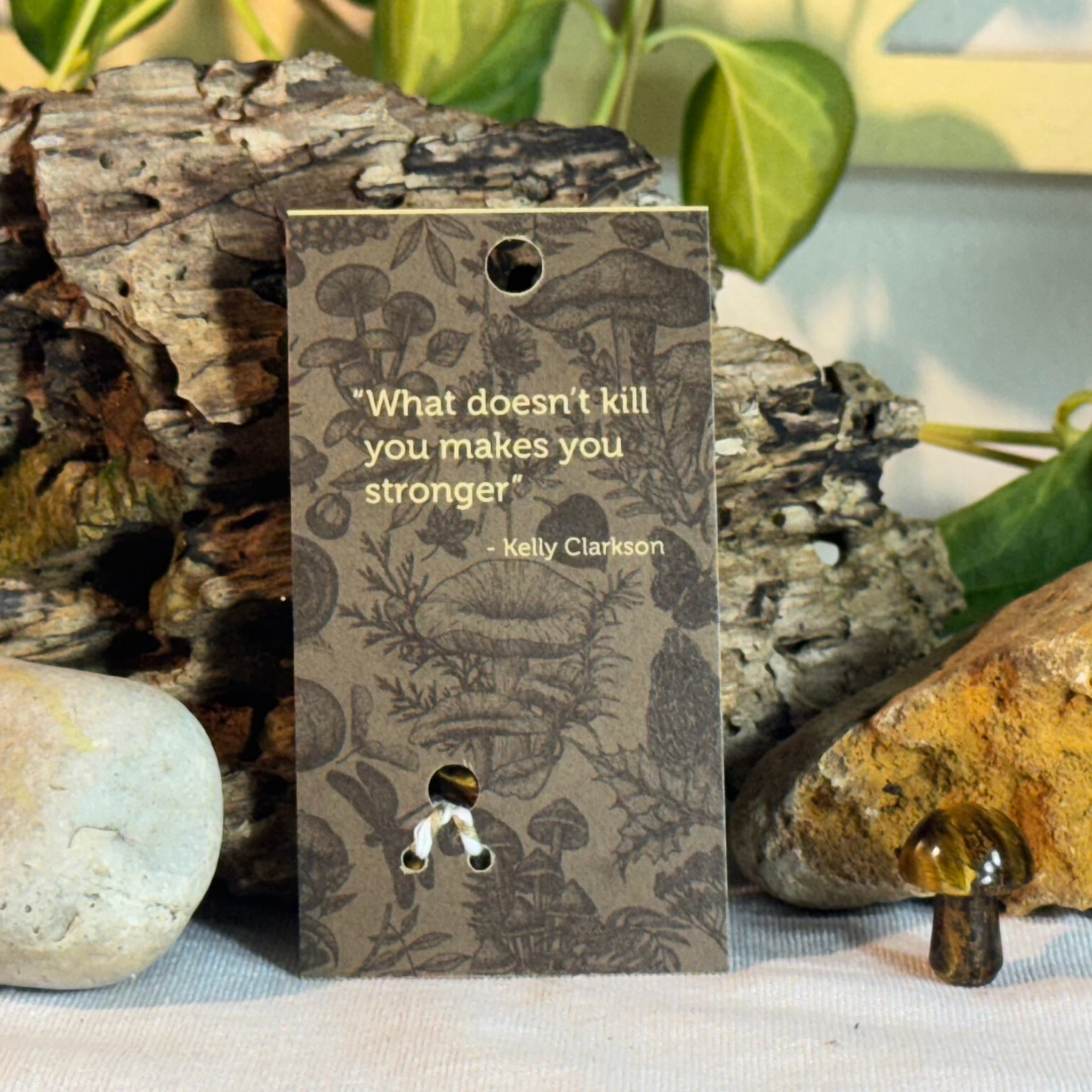 Card with mushroom design and Kelly Clarkson quote on a natural background