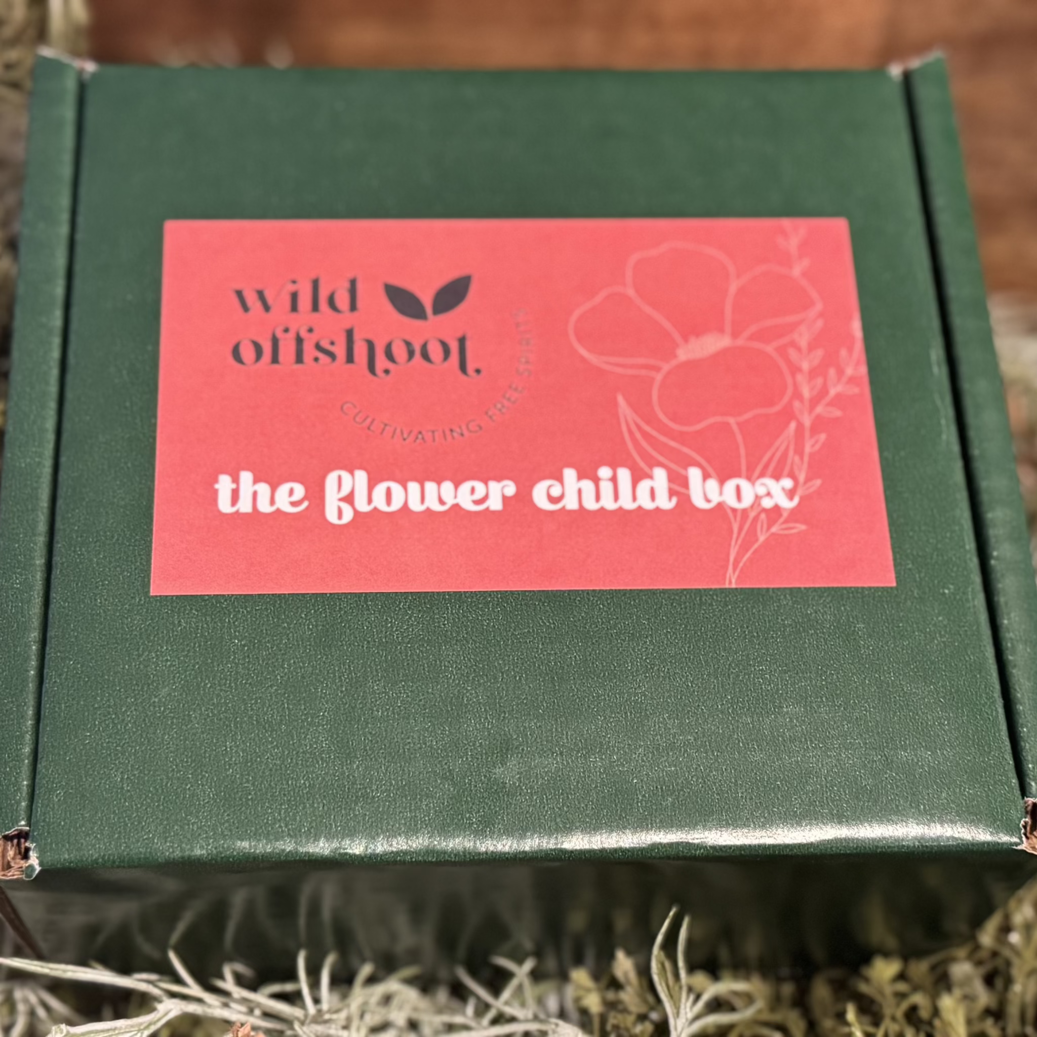 A green box with a label that reads 'Wild Offshoot THE FLOWER CHILD BOX.
